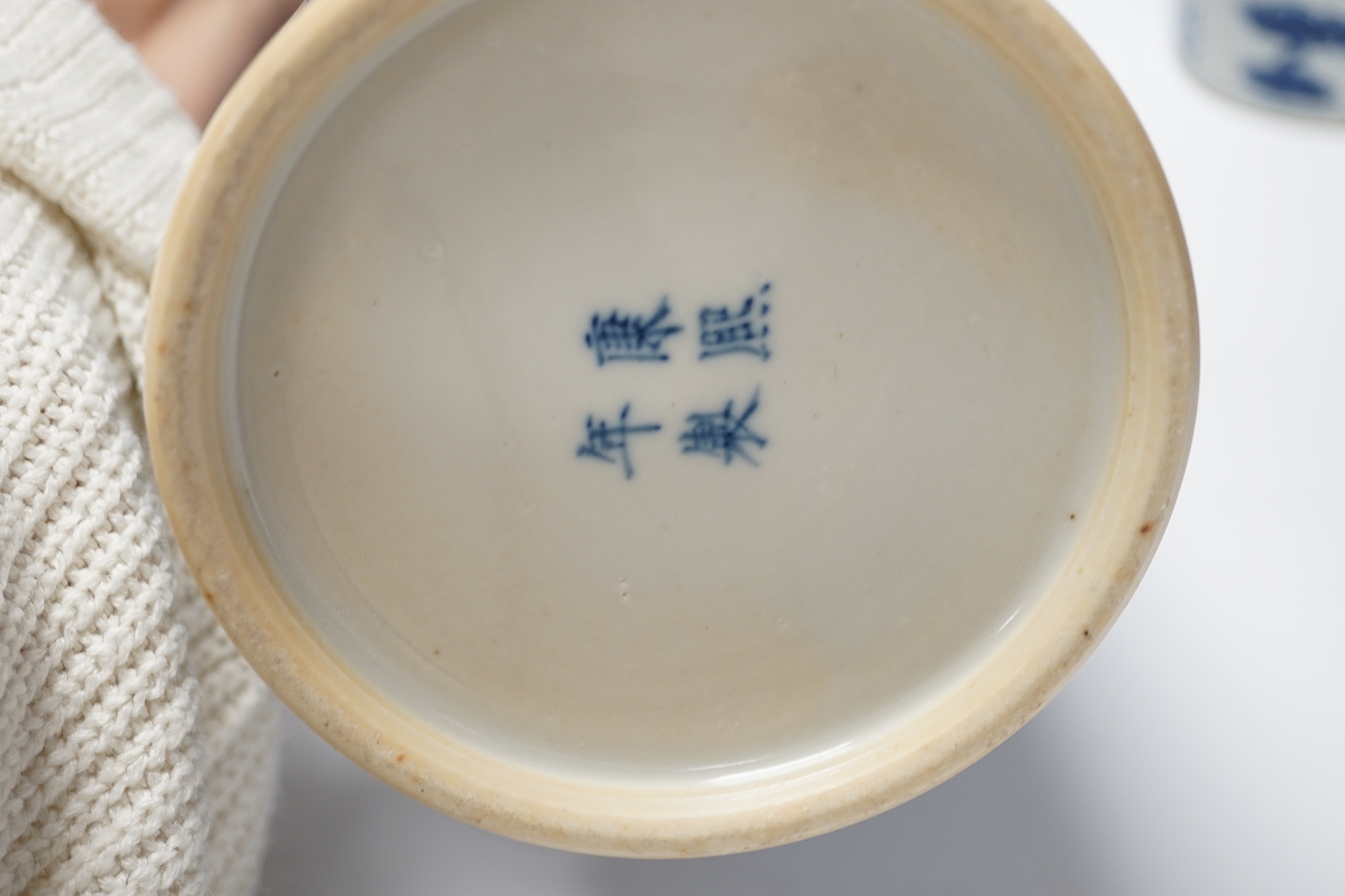 A pair of Chinese blue and white cylindrical hat stands, 29cm high and a Japanese porcelain vase modelled as bamboo